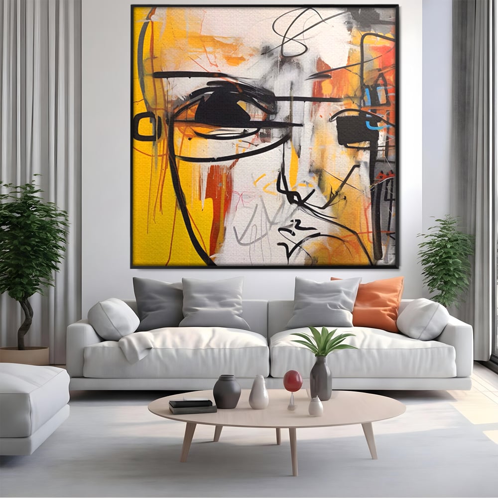 Tablou canvas cu pictura abstracta cu chip stilizat, in rama de aluminiu negru, pe perete intr-un living